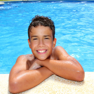 Boy at the pool, smiling