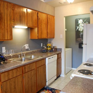 Alternative view of model home kitchen with white appliance package